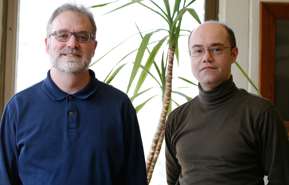 David Drabold and Serge Nakhmanson standing together near a window.