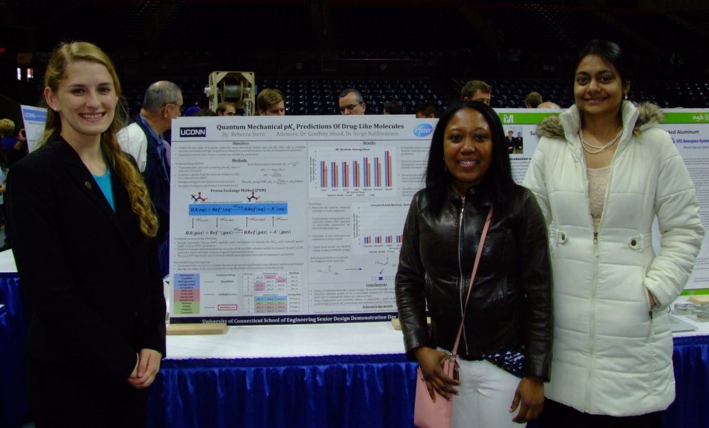 CMCD group members Rebecca Stern, Lydie Louis and Ayana Ghosh standing near Rebecca's Senior design poster.